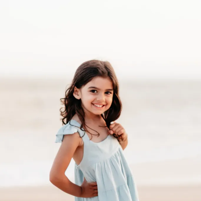 Young girl smiling at the beach