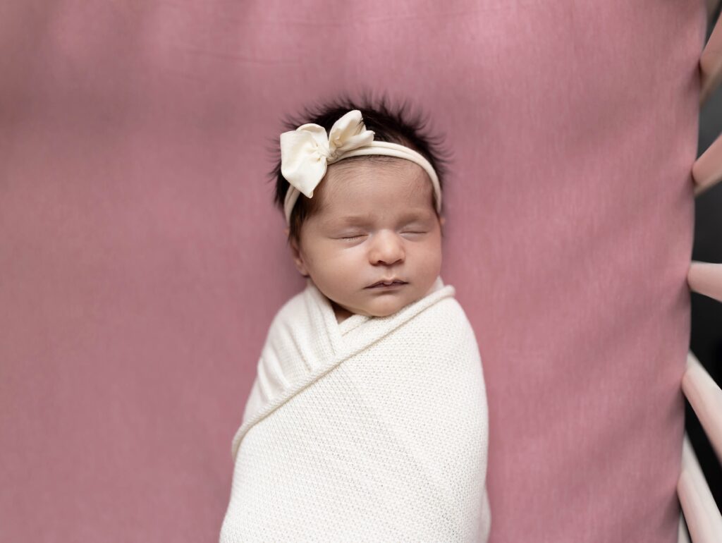 Newborn baby wrapped in a white blanket