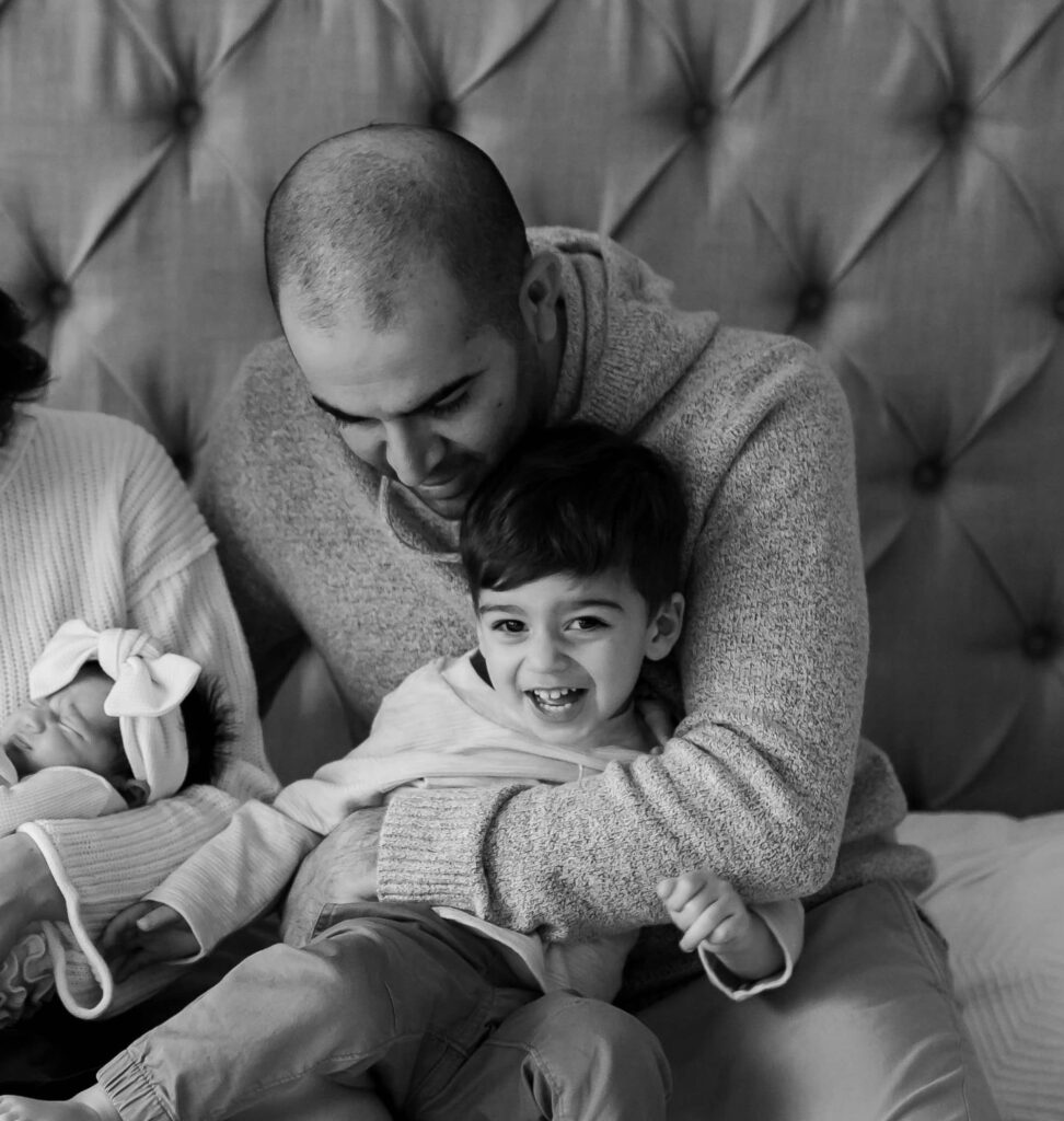 Father holding his smiling young son