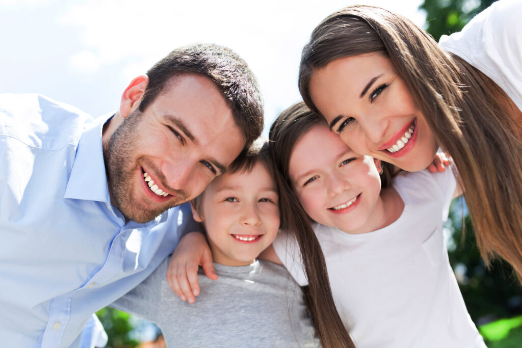 Parents smiling with their two children